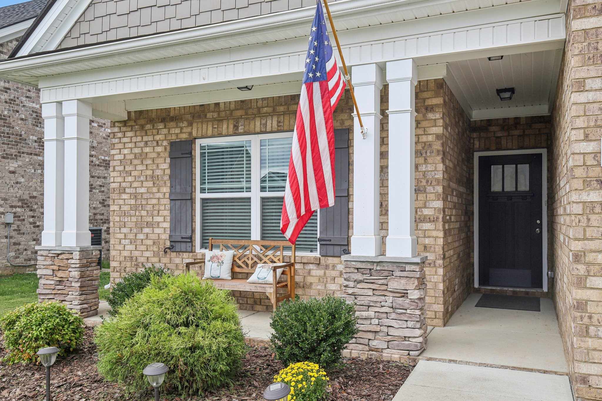 211 Thorpe Dr Spring Hill Spring Hill, TN 37174 - Photo 3 of 38 a front view of a house with outdoor seating and plants