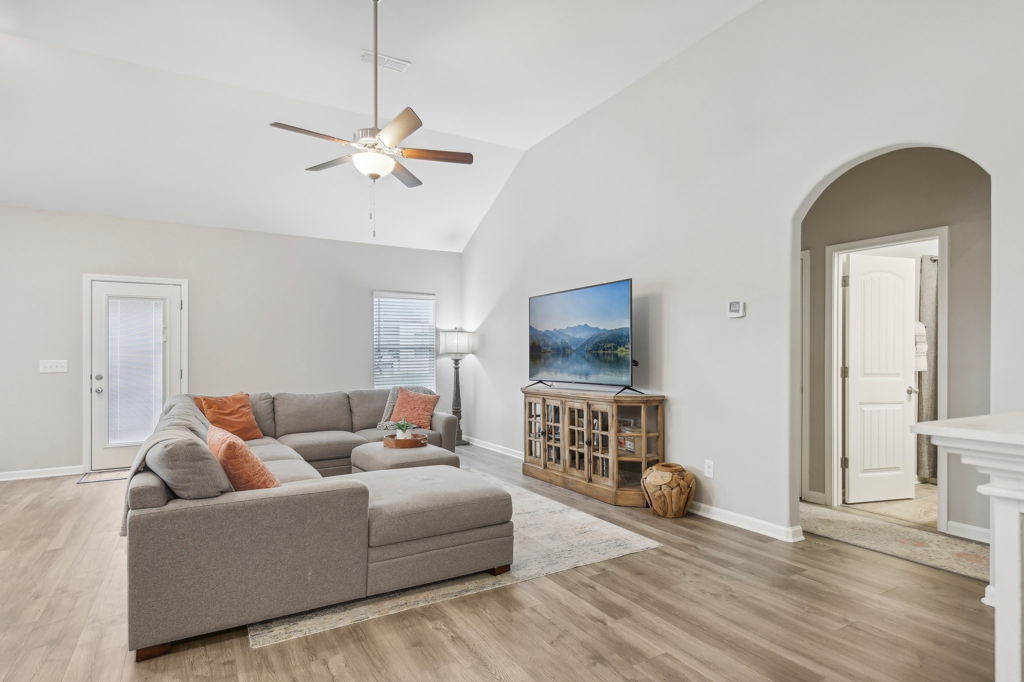 211 Thorpe Dr Spring Hill Spring Hill, TN 37174 - Photo 5 of 38 a living room with furniture and a flat screen tv