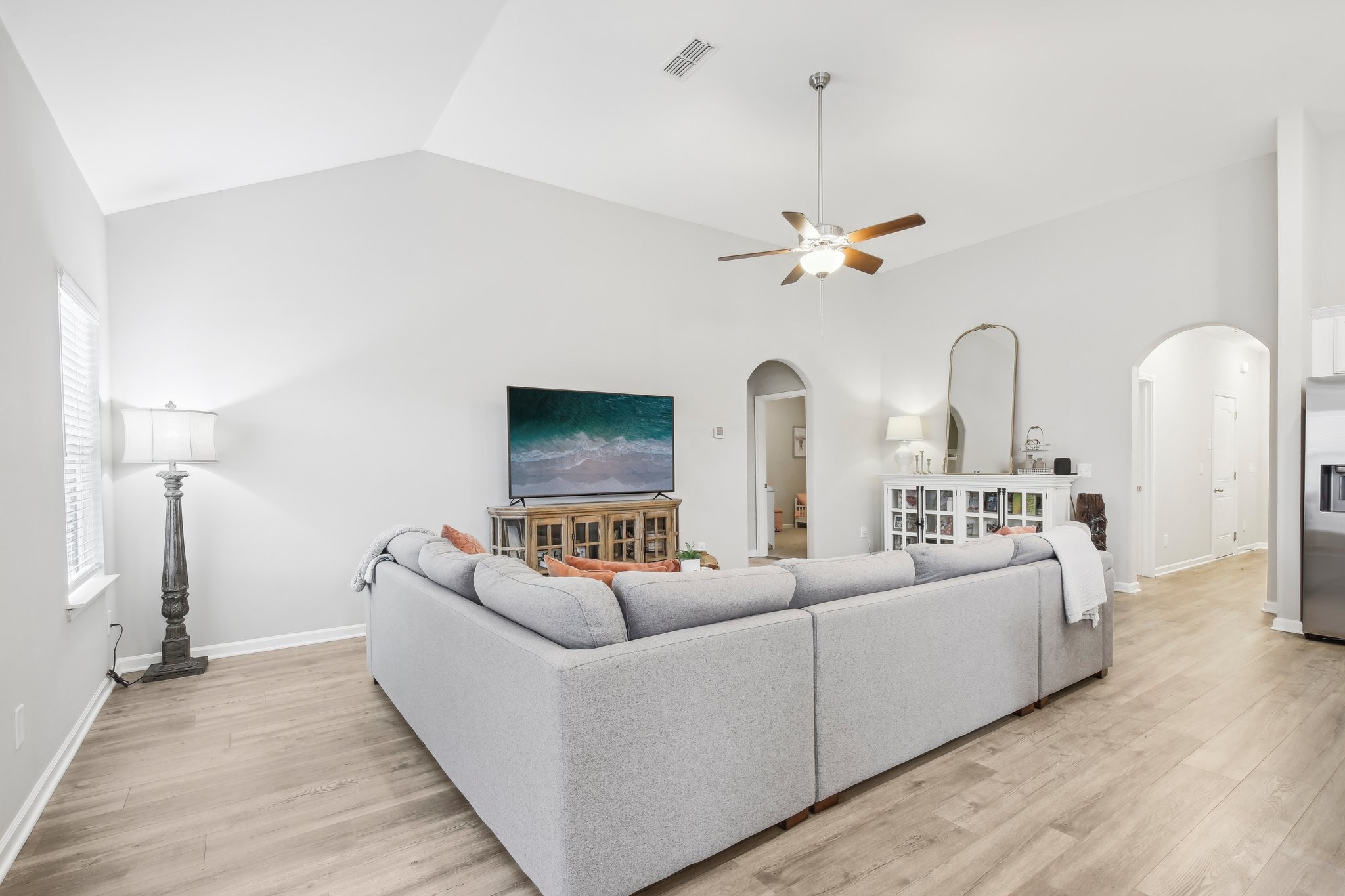 211 Thorpe Dr Spring Hill Spring Hill, TN 37174 - Photo 8 of 38 a living room with furniture a chandelier and a rug