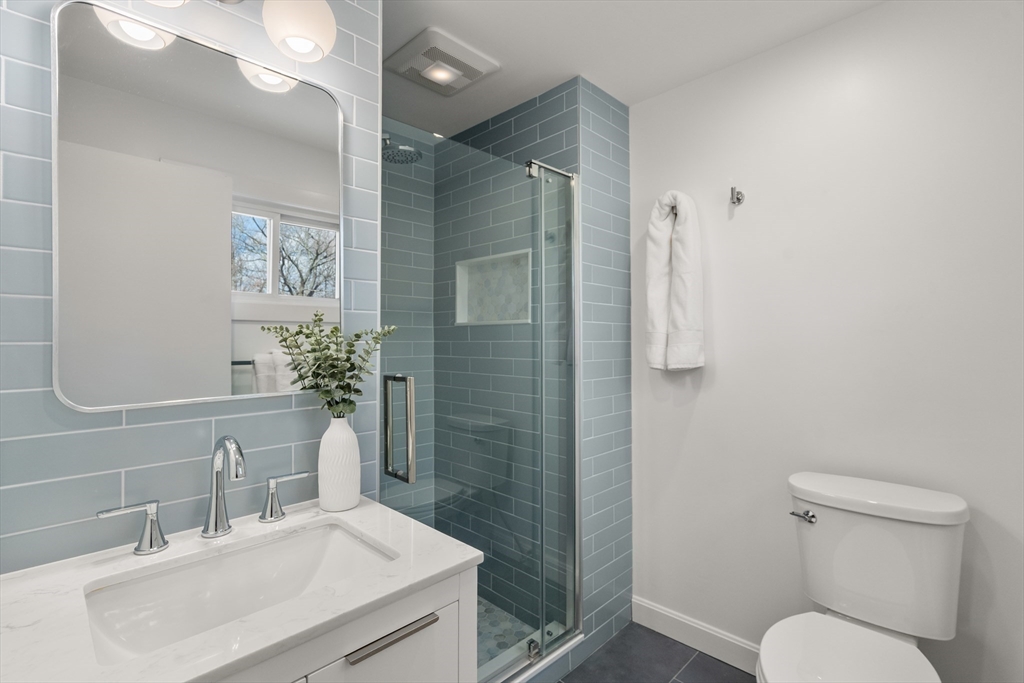 13 Berkeley Road Framingham, MA 01701 - Photo 14 of 32 a bathroom with a sink toilet and shower