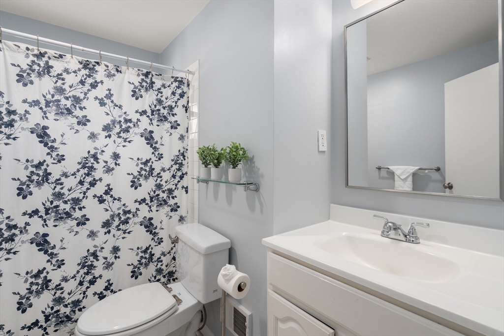 13 Berkeley Road Framingham, MA 01701 - Photo 16 of 32 a bathroom with a sink toilet and shower