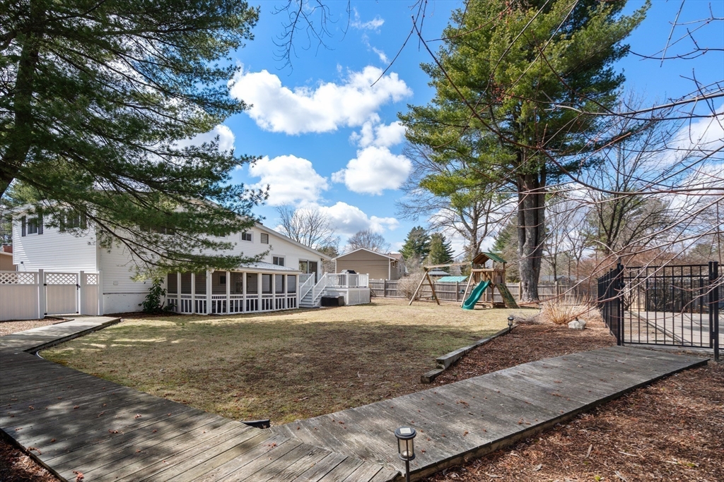 13 Berkeley Road Framingham, MA 01701 - Photo 28 of 32 a view of a white house with a yard
