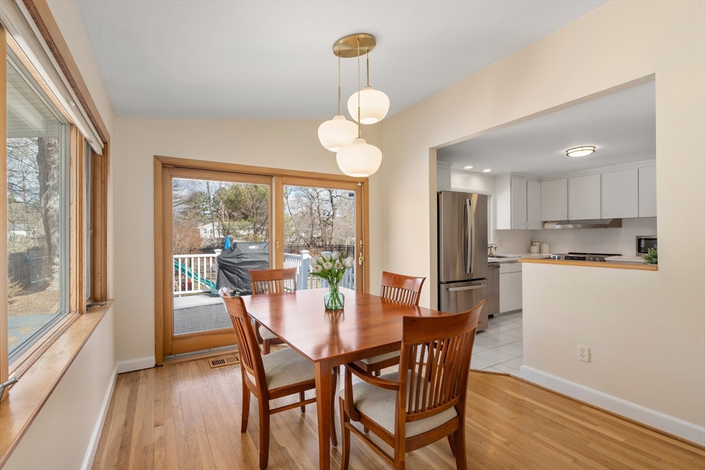 13 Berkeley Road Framingham, MA 01701 - Photo 6 of 32 a view of a dining room with furniture a chandelier and wooden floor