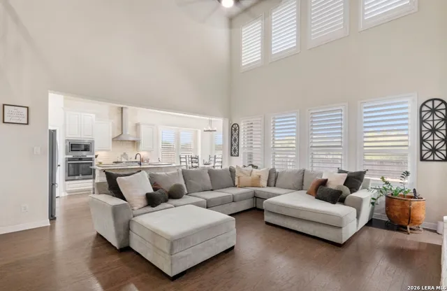 a living room with furniture and a large window