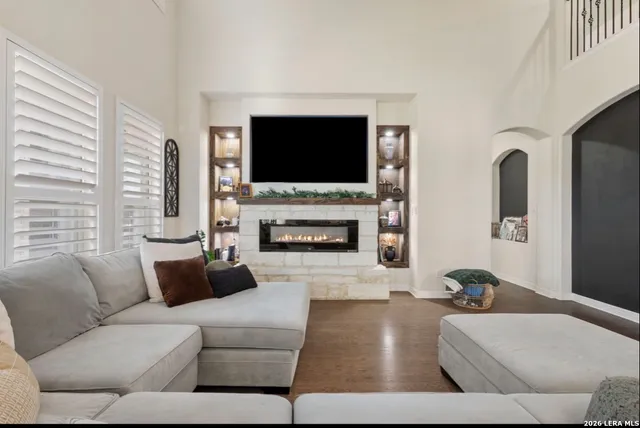 a living room with furniture and a flat screen tv