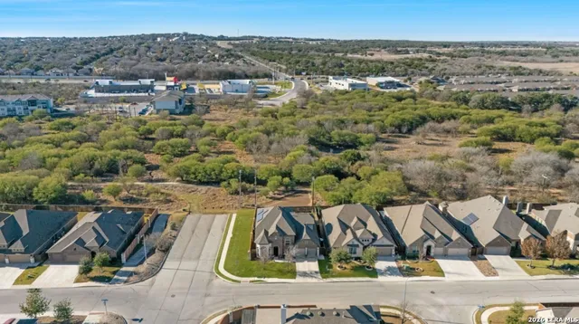 an aerial view of residential house and outdoor space
