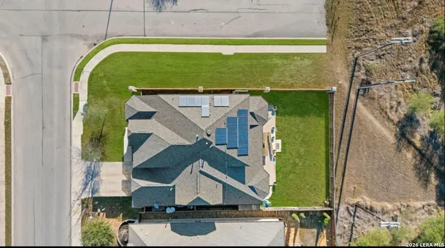 an aerial view of a house with a garden