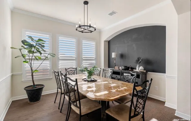 a view of a dining room with furniture window and outside view
