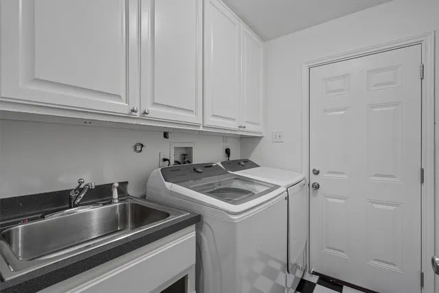 a kitchen with a sink and cabinets