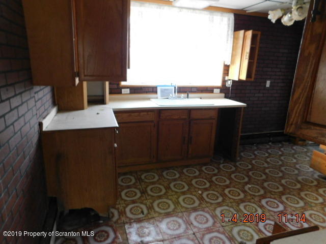 1693 Cortez Road Waymart, PA 18472 - Photo 11 of 29 a bathroom with a sink and a mirror