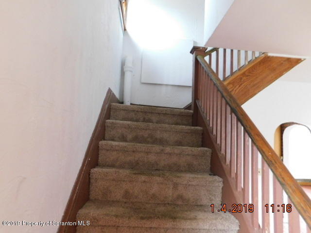 1693 Cortez Road Waymart, PA 18472 - Photo 15 of 29 a view of staircase with wooden floor and white walls