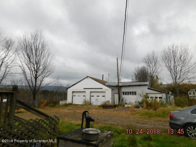1693 Cortez Road Waymart, PA 18472 - Photo 6 of 29 a front view of a house with garden