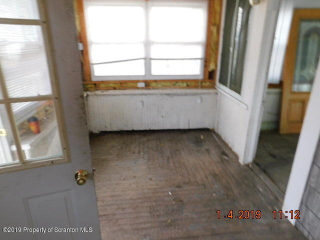 1693 Cortez Road Waymart, PA 18472 - Photo 7 of 29 a view of an empty room with a window