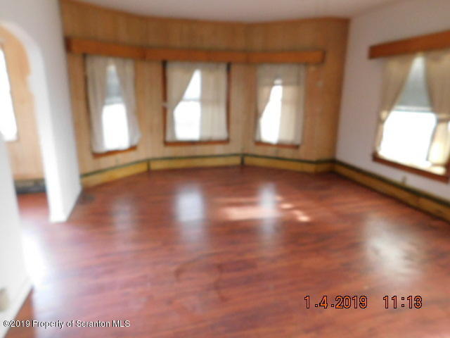 1693 Cortez Road Waymart, PA 18472 - Photo 9 of 29 a view of empty room with wooden floor and fan