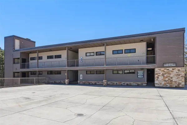 a front view of a building with a pathway