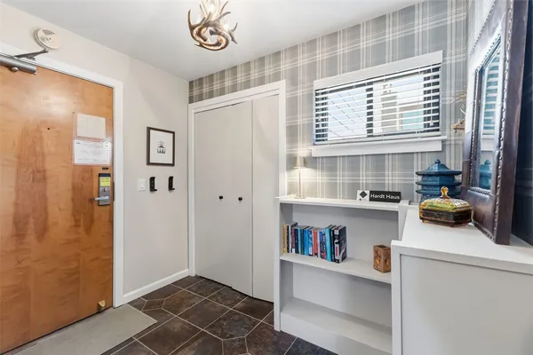 a kitchen with a refrigerator and a window