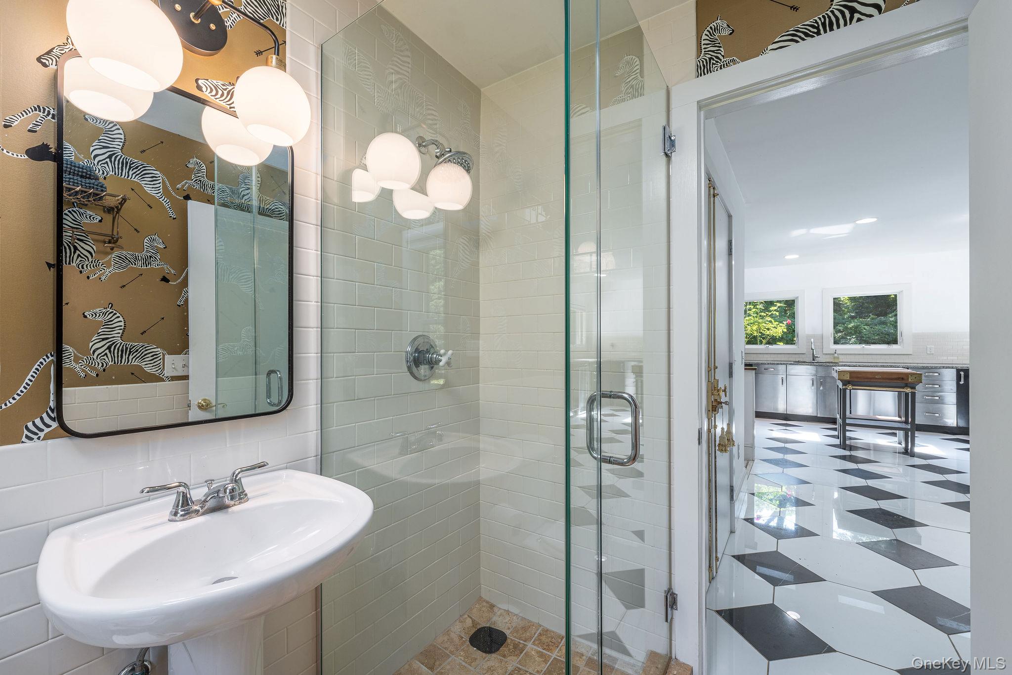 1 Gazon Road Shelter Island, NY 11964 - Photo 13 of 35 a bathroom with a sink and a mirror
