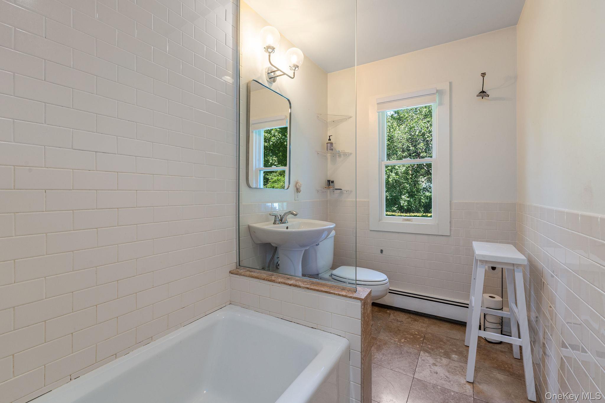 1 Gazon Road Shelter Island, NY 11964 - Photo 18 of 35 a bathroom with a sink and a bathtub