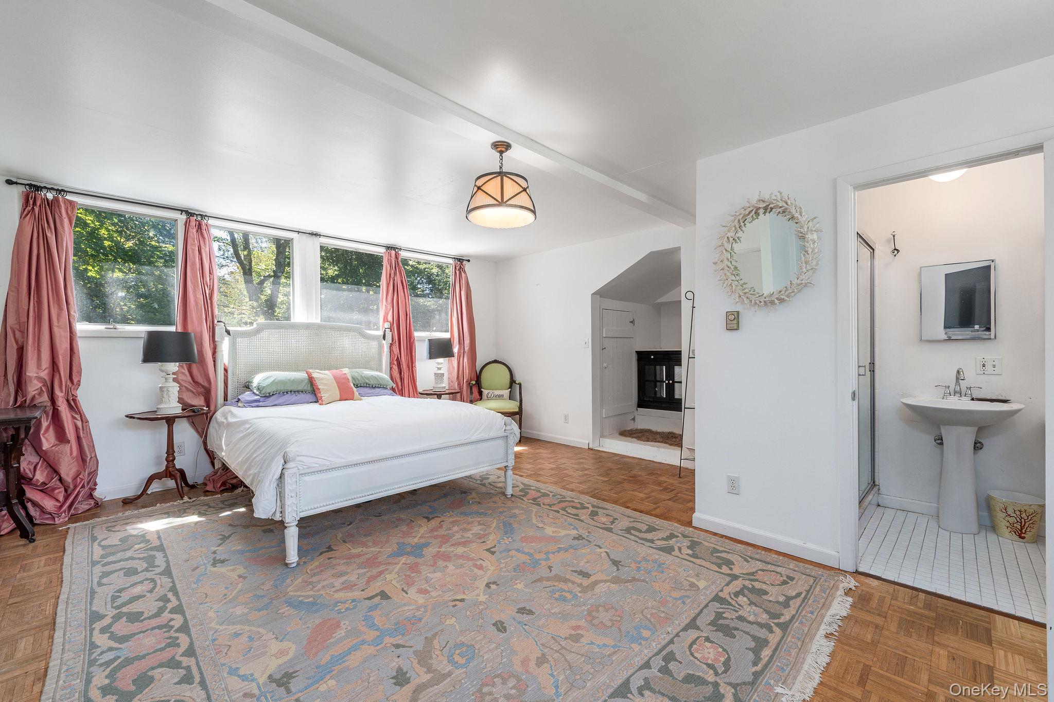 1 Gazon Road Shelter Island, NY 11964 - Photo 19 of 35 a bedroom with a bed and wooden floor