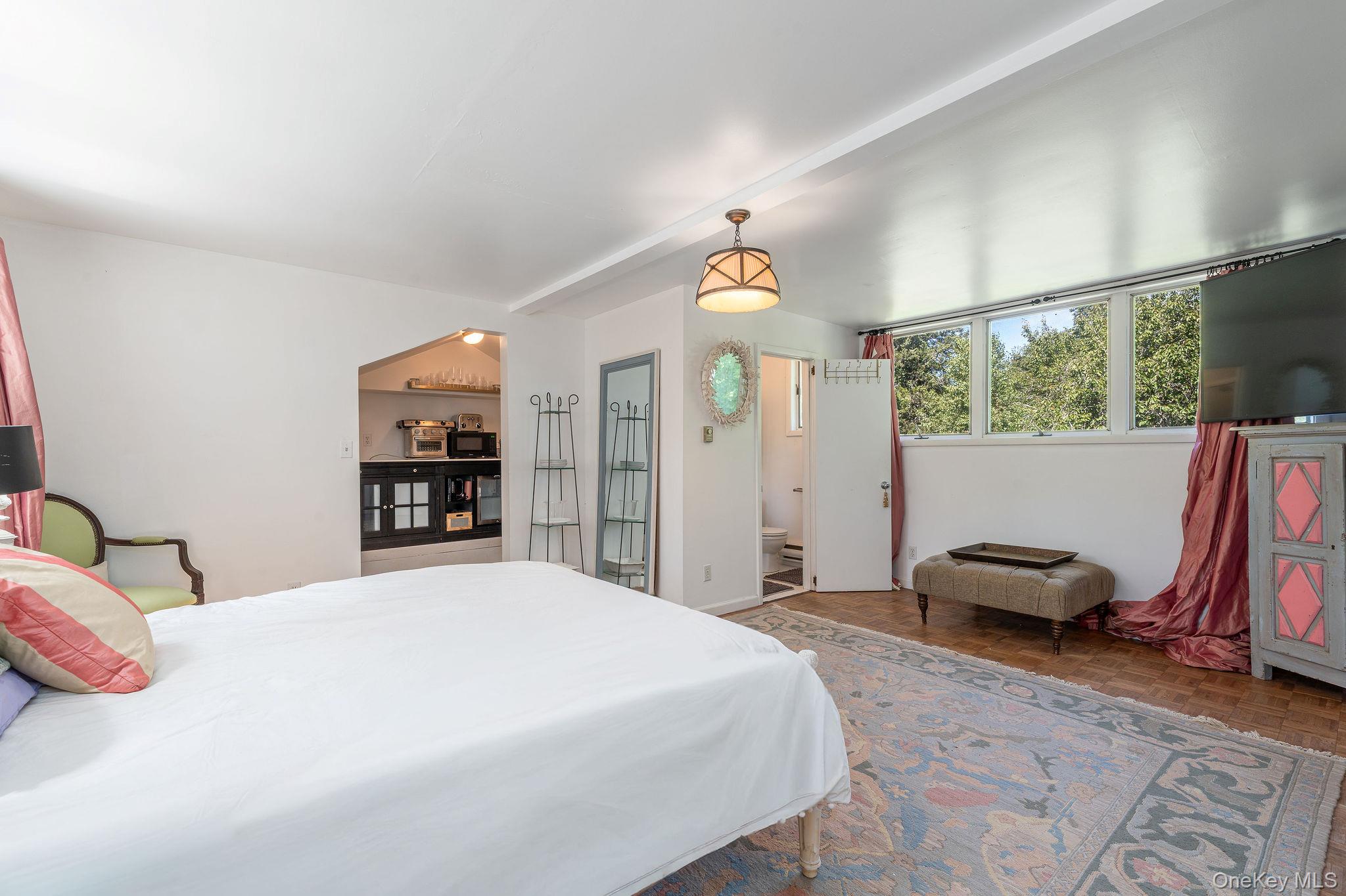 1 Gazon Road Shelter Island, NY 11964 - Photo 20 of 35 a bedroom with a bed and a window