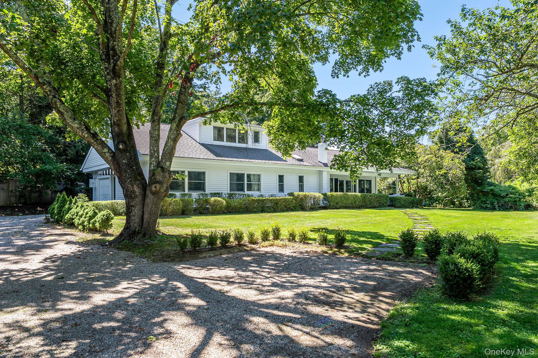 1 Gazon Road Shelter Island, NY 11964 - Photo 2 of 35 a front view of a house with yard and green space