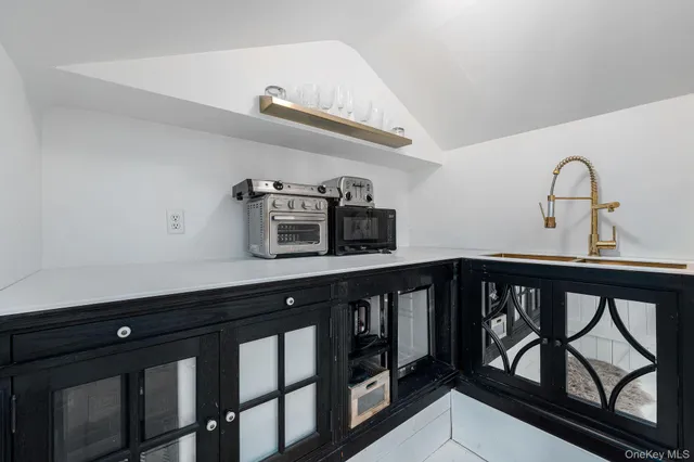 a view of a hallway with seating area