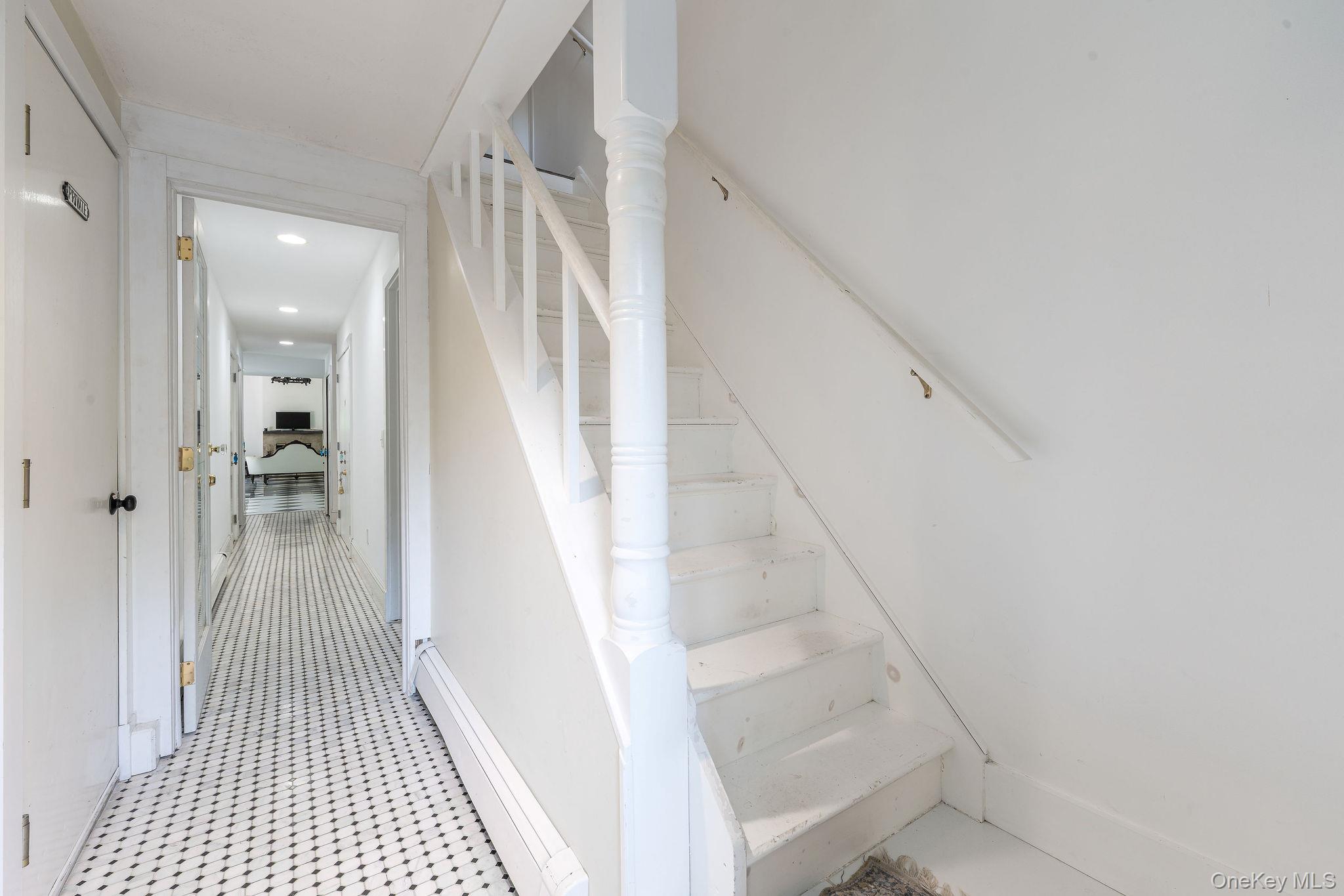 1 Gazon Road Shelter Island, NY 11964 - Photo 24 of 35 a view of a hallway with wooden floor and staircase