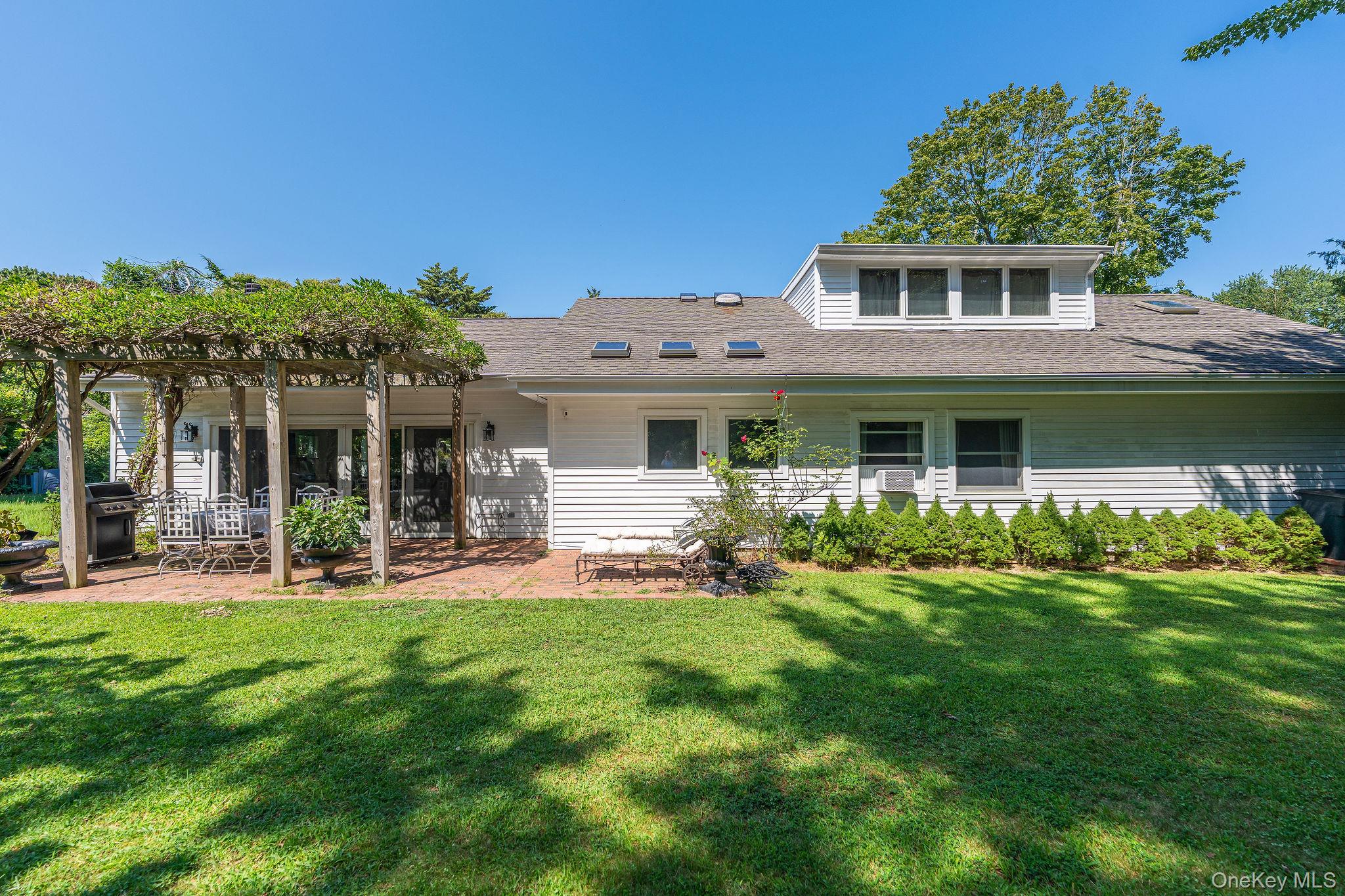 1 Gazon Road Shelter Island, NY 11964 - Photo 29 of 35 front view of a house with a garden