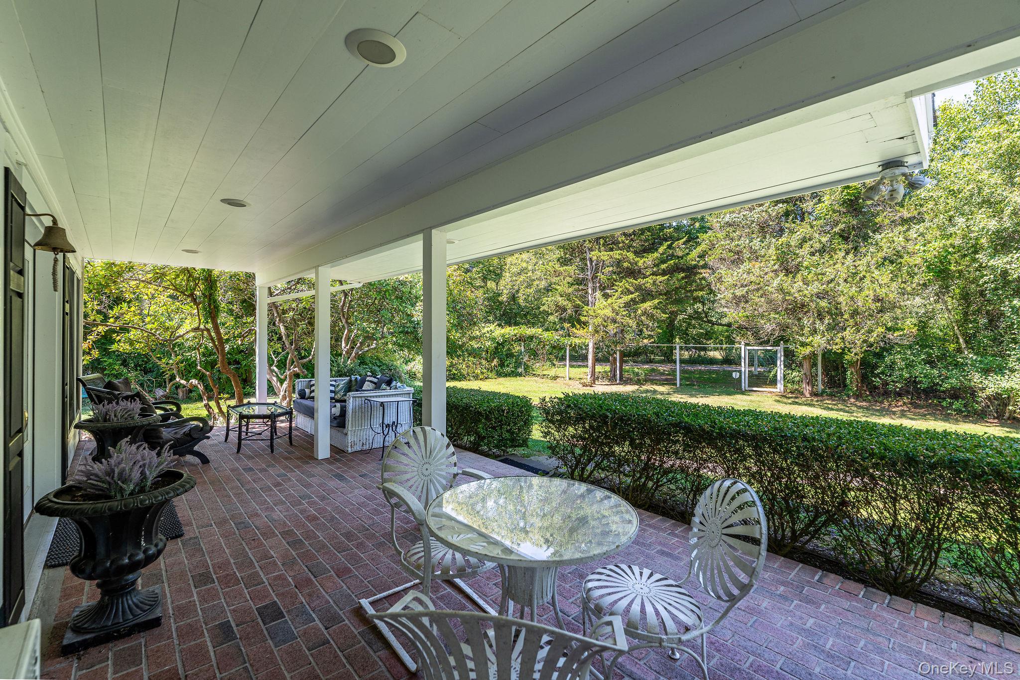 1 Gazon Road Shelter Island, NY 11964 - Photo 6 of 35 a view of a porch with furniture and yard