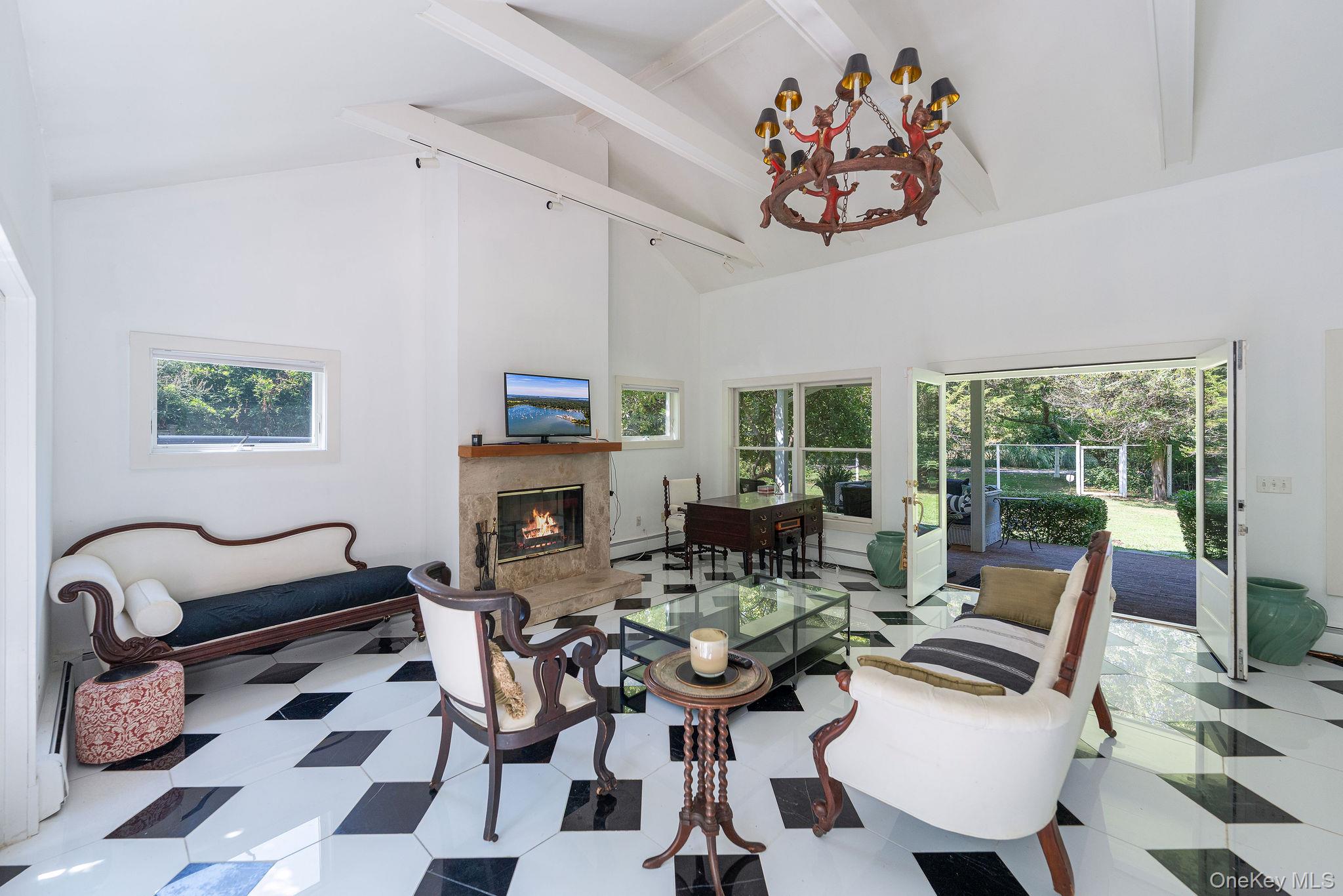 1 Gazon Road Shelter Island, NY 11964 - Photo 9 of 35 a living room with furniture a rug and a large window