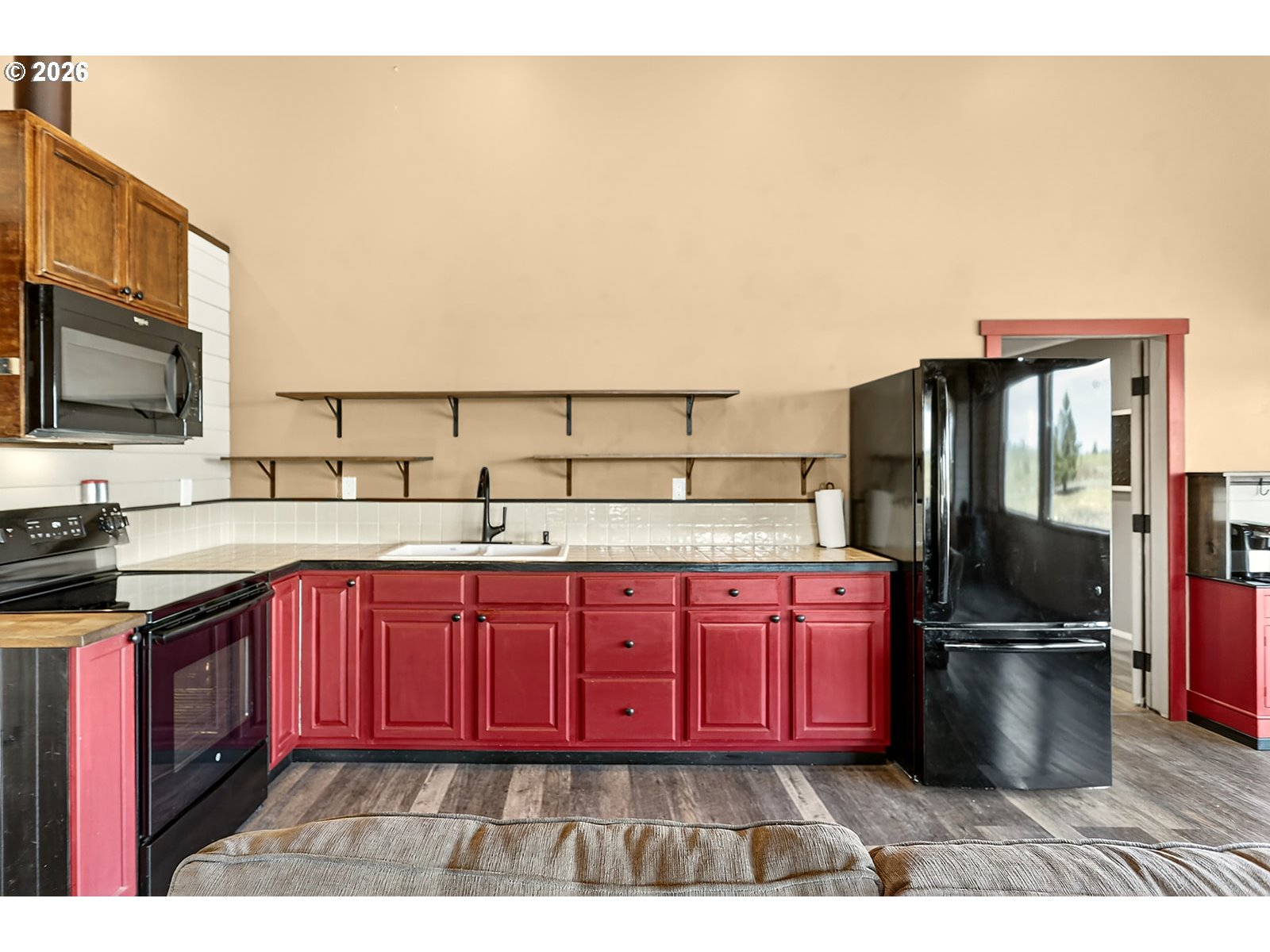 250 Schilling Road Lyle, WA 98635 - Photo 16 of 46 a kitchen with a sink wooden cabinets and stainless steel appliances