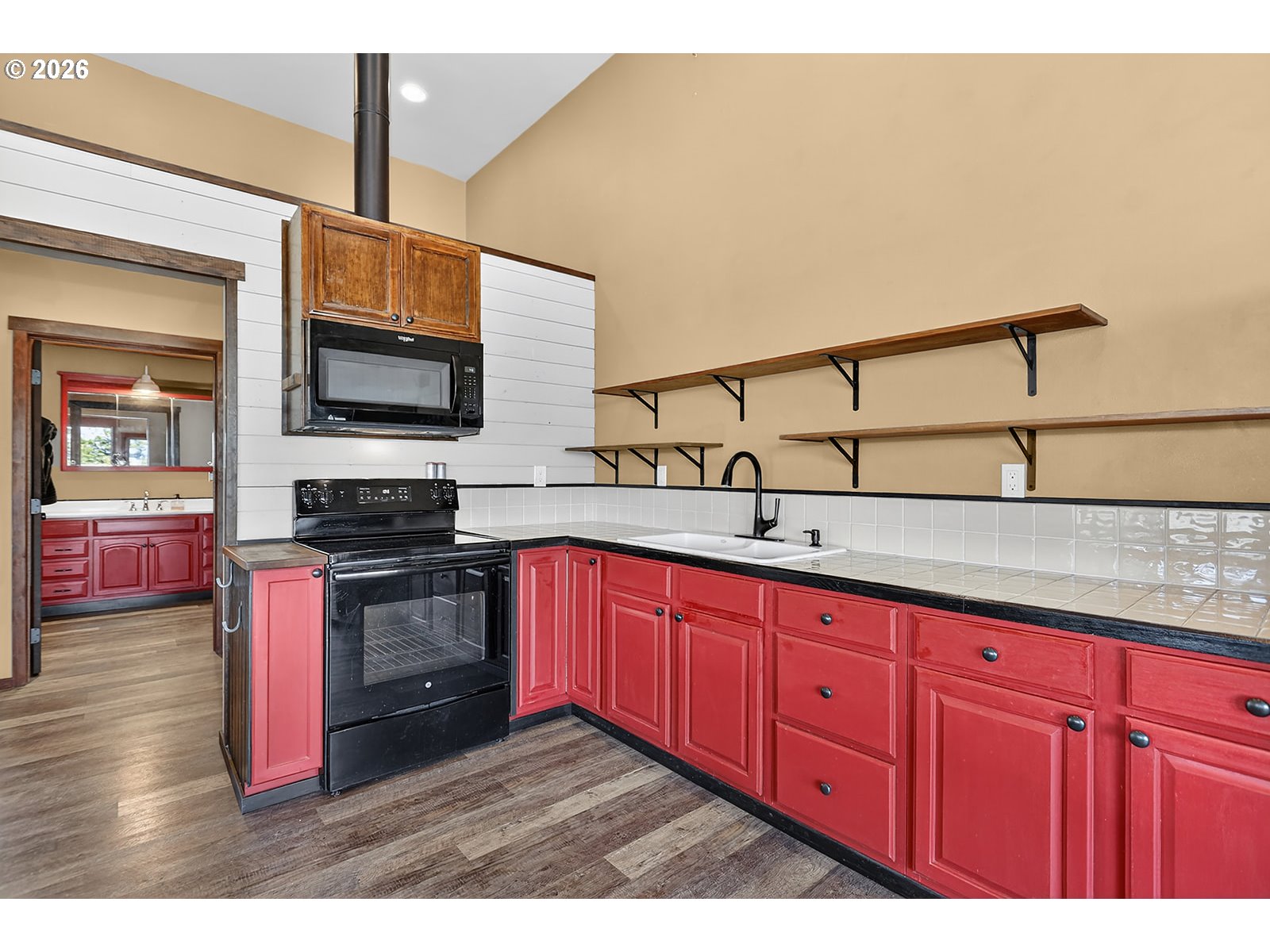250 Schilling Road Lyle, WA 98635 - Photo 17 of 46 a kitchen with stainless steel appliances granite countertop a sink and a stove