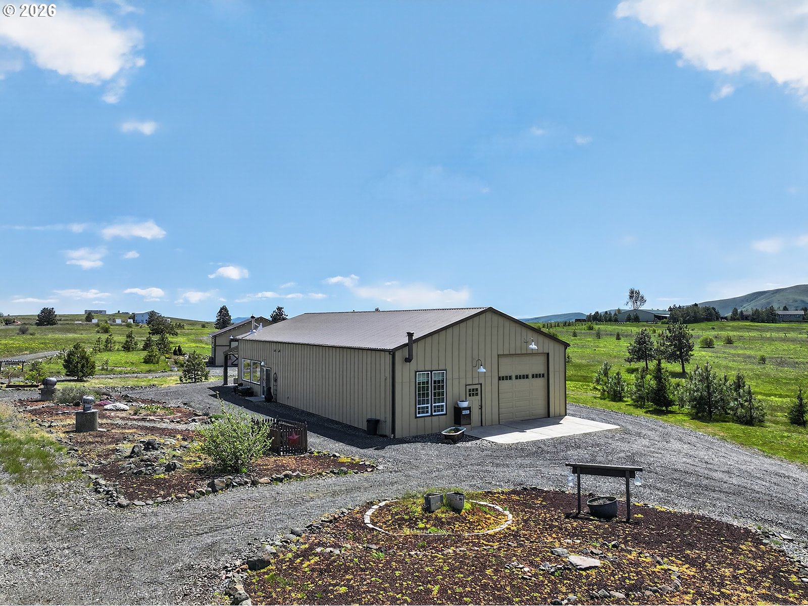 250 Schilling Road Lyle, WA 98635 - Photo 3 of 46 a front view of a house with a yard