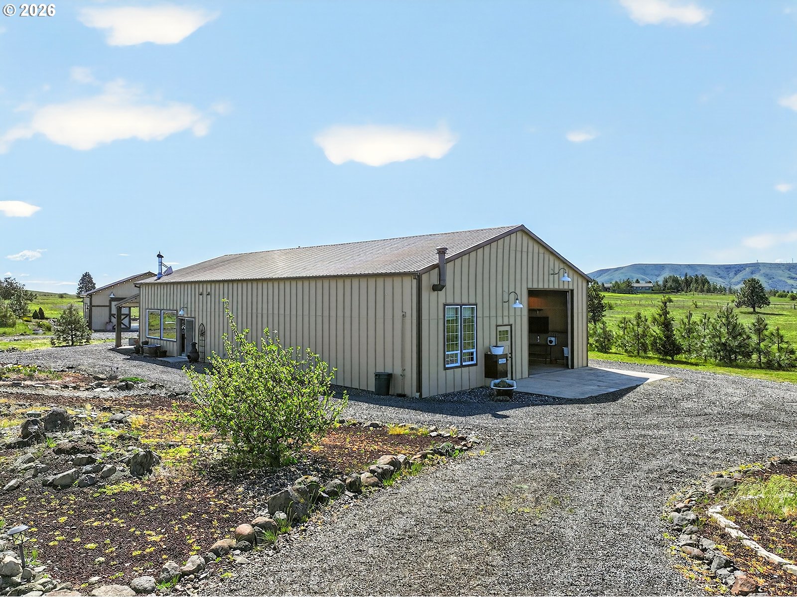 250 Schilling Road Lyle, WA 98635 - Photo 4 of 46 a front view of a house with garden