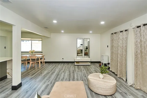 a room with furniture and wooden floor