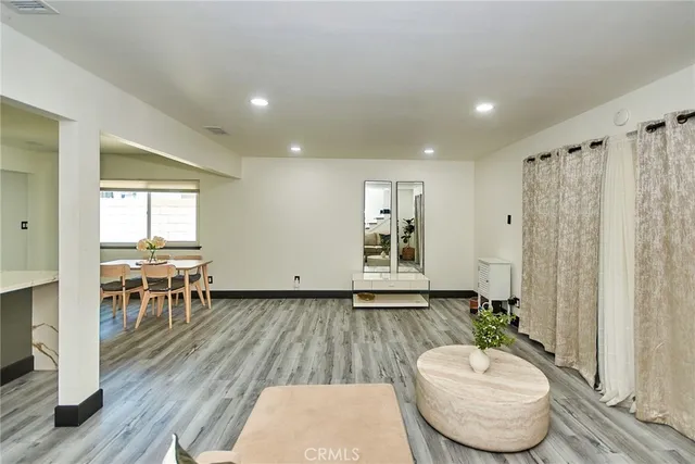a room with furniture and wooden floor
