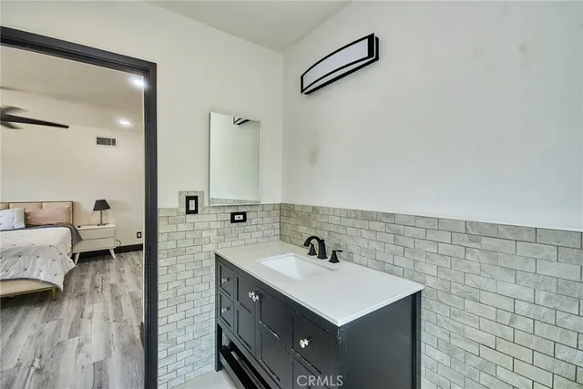 a bathroom with a sink and a mirror