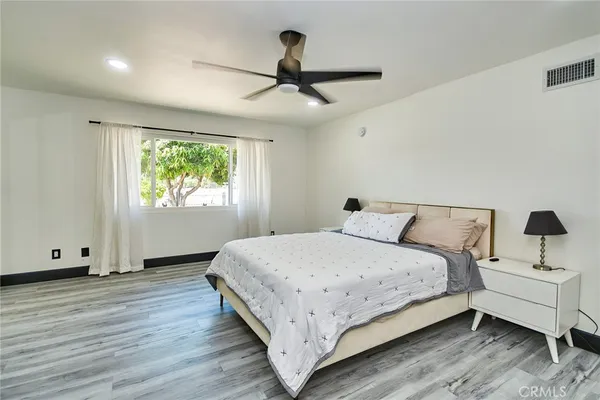 a bedroom with bed and window