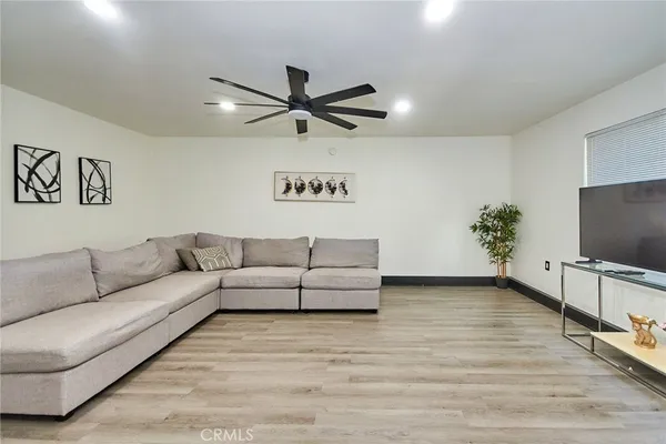 a view of a livingroom with furniture and a flat screen tv