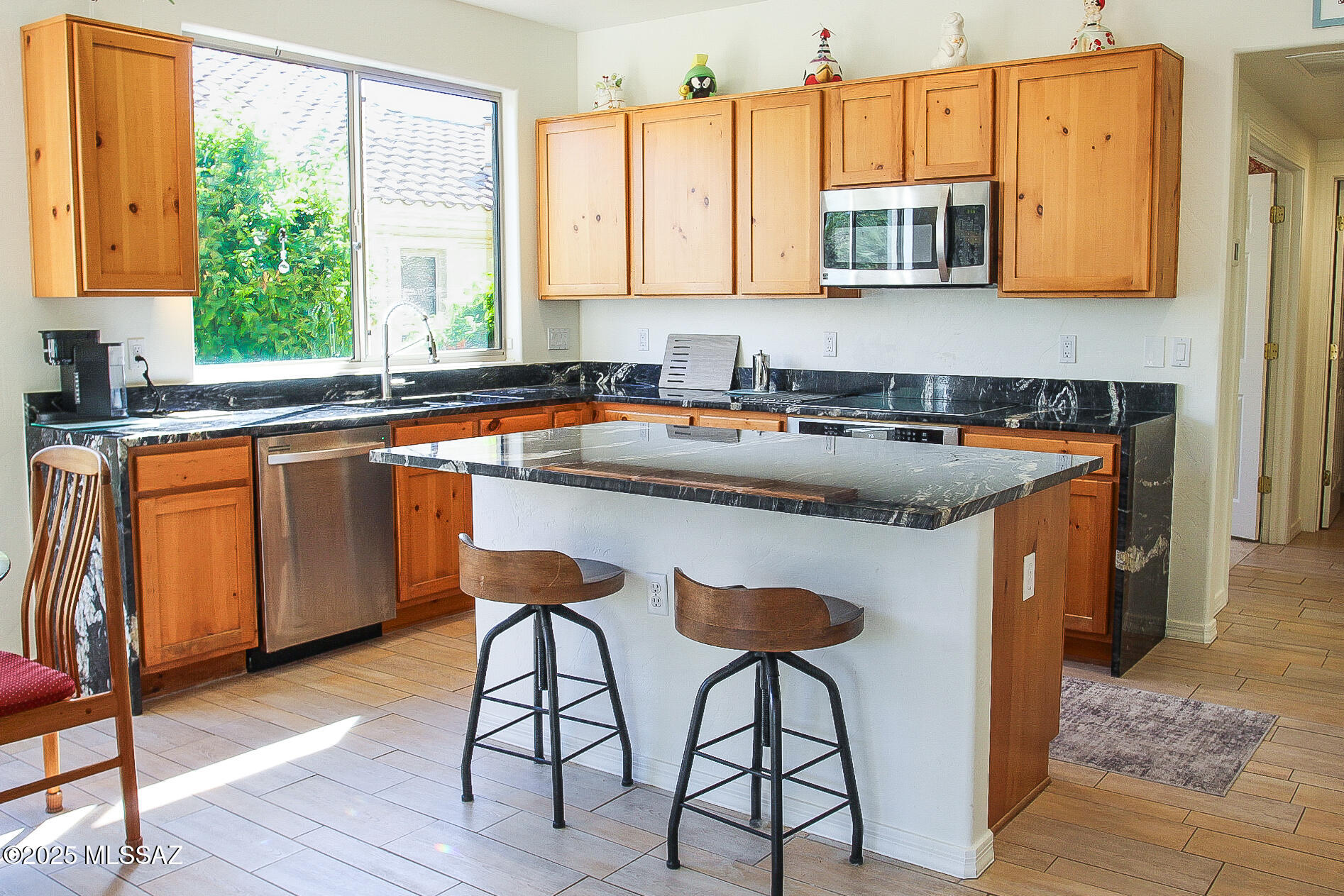 5202 Spring View Drive Tucson, AZ 85749 - Photo 18 of 49 a kitchen with stainless steel appliances granite countertop a stove a sink and a microwave