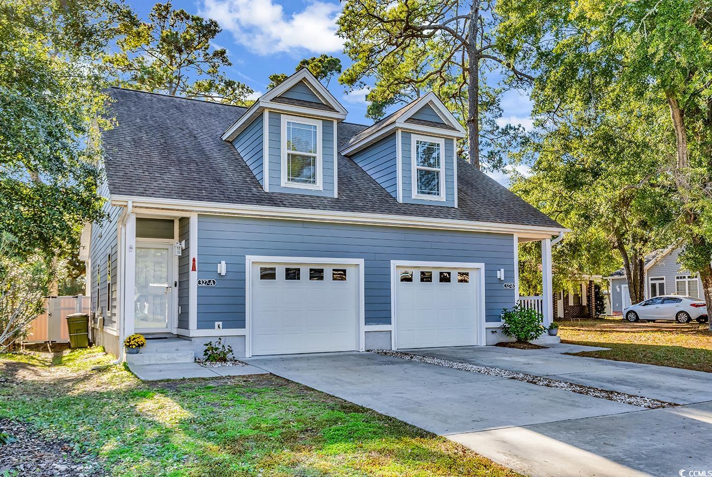 Garage featuring driveway