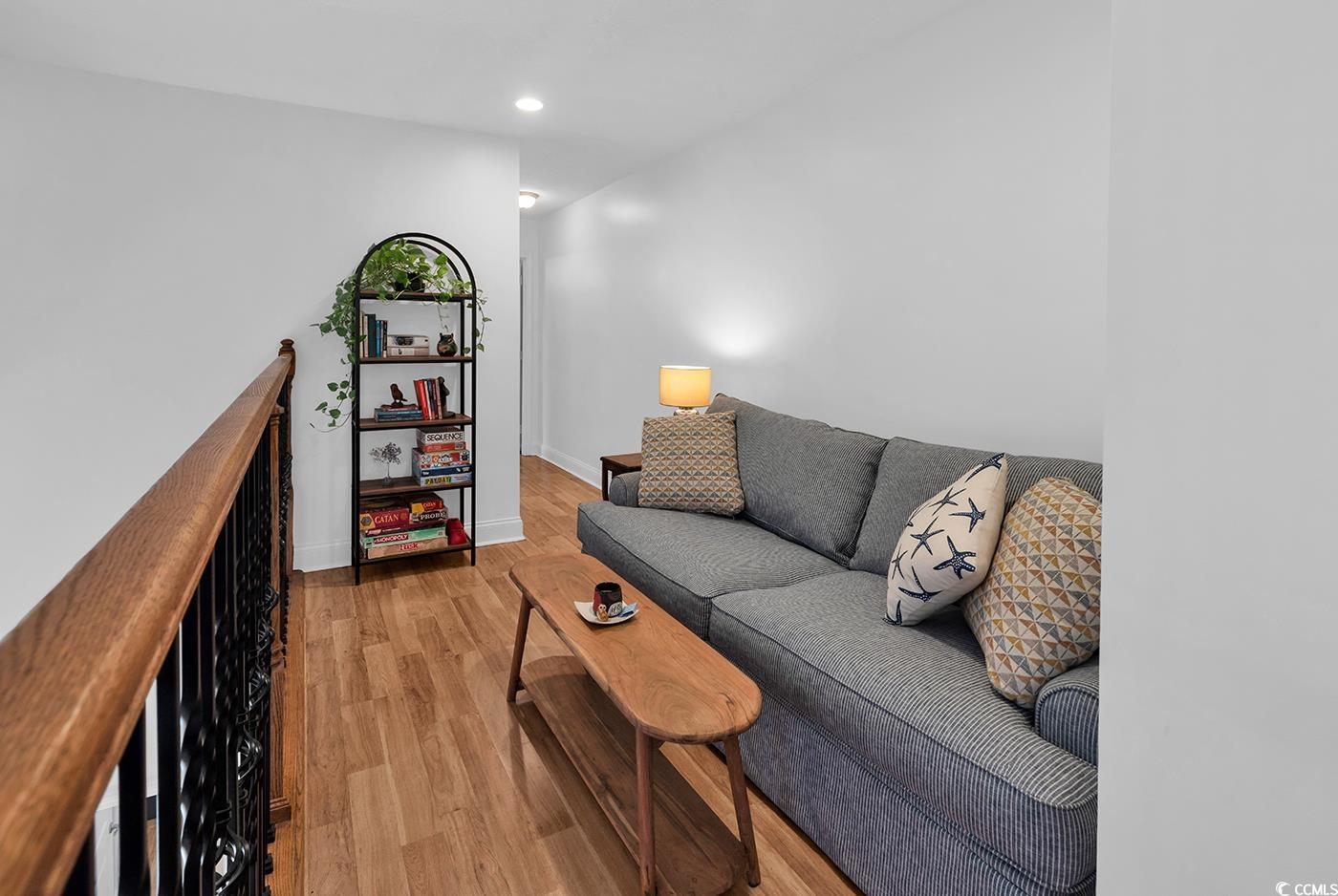 327-a&b Sparrow Drive Surfside Beach, SC 29575 - Photo 11 of 33 Living room featuring light wood-style flooring and recessed lighting