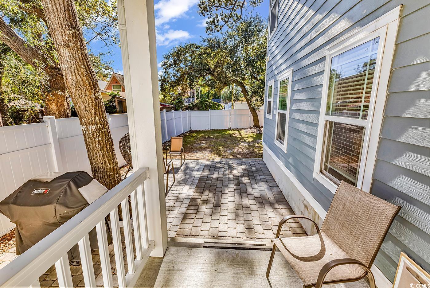 327-a&b Sparrow Drive Surfside Beach, SC 29575 - Photo 17 of 33 Wooden terrace featuring a fenced backyard, a grill, and a patio area