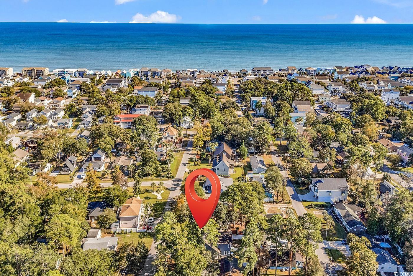 327-a&b Sparrow Drive Surfside Beach, SC 29575 - Photo 33 of 33 Aerial overview of property's location with nearby suburban area and a large body of water