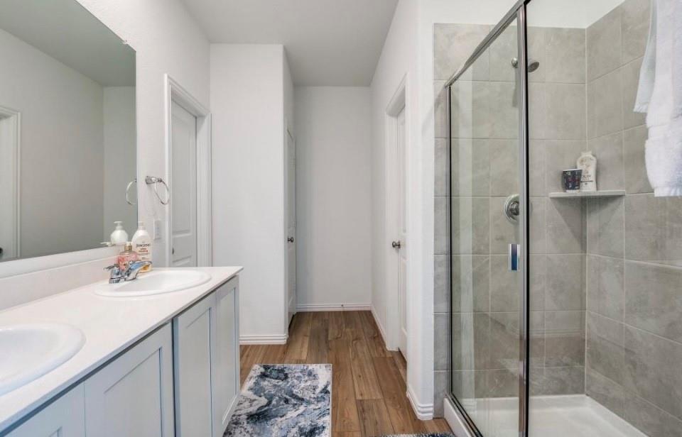 8424 Gray Squirrel Ln. McKinney, TX 75071 - Photo 13 of 22 a bathroom with a sink and a mirror