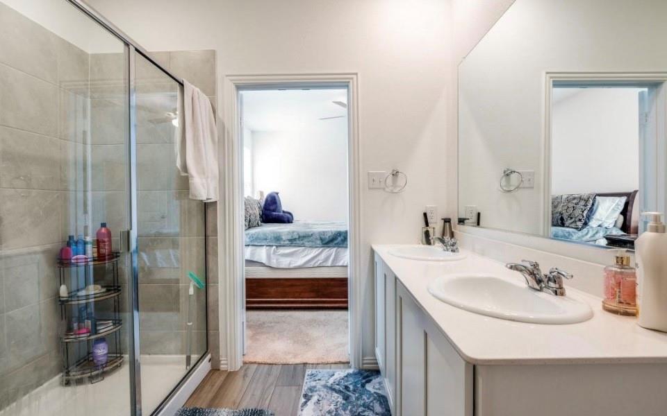 8424 Gray Squirrel Ln. McKinney, TX 75071 - Photo 14 of 22 a bathroom with a sink and a mirror