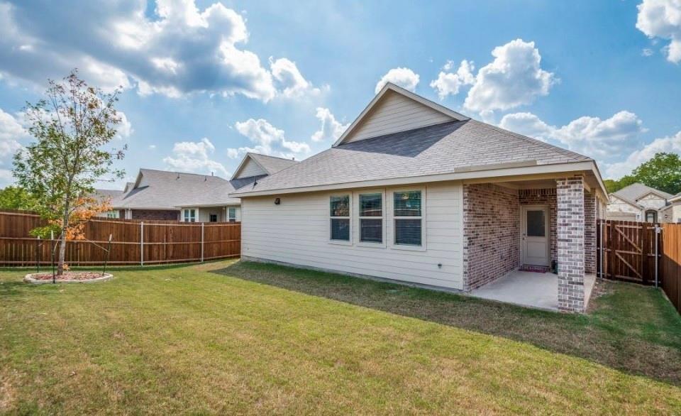 8424 Gray Squirrel Ln. McKinney, TX 75071 - Photo 16 of 22 a view of a house with a yard and a garden