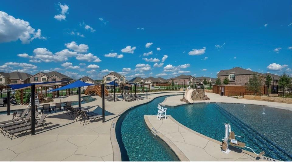 8424 Gray Squirrel Ln. McKinney, TX 75071 - Photo 19 of 22 a view of a swimming pool with outdoor seating