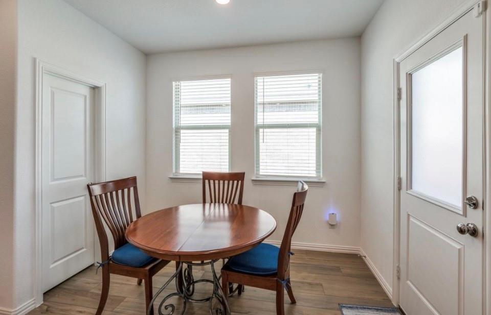 8424 Gray Squirrel Ln. McKinney, TX 75071 - Photo 8 of 22 a view of a dining room with furniture and window