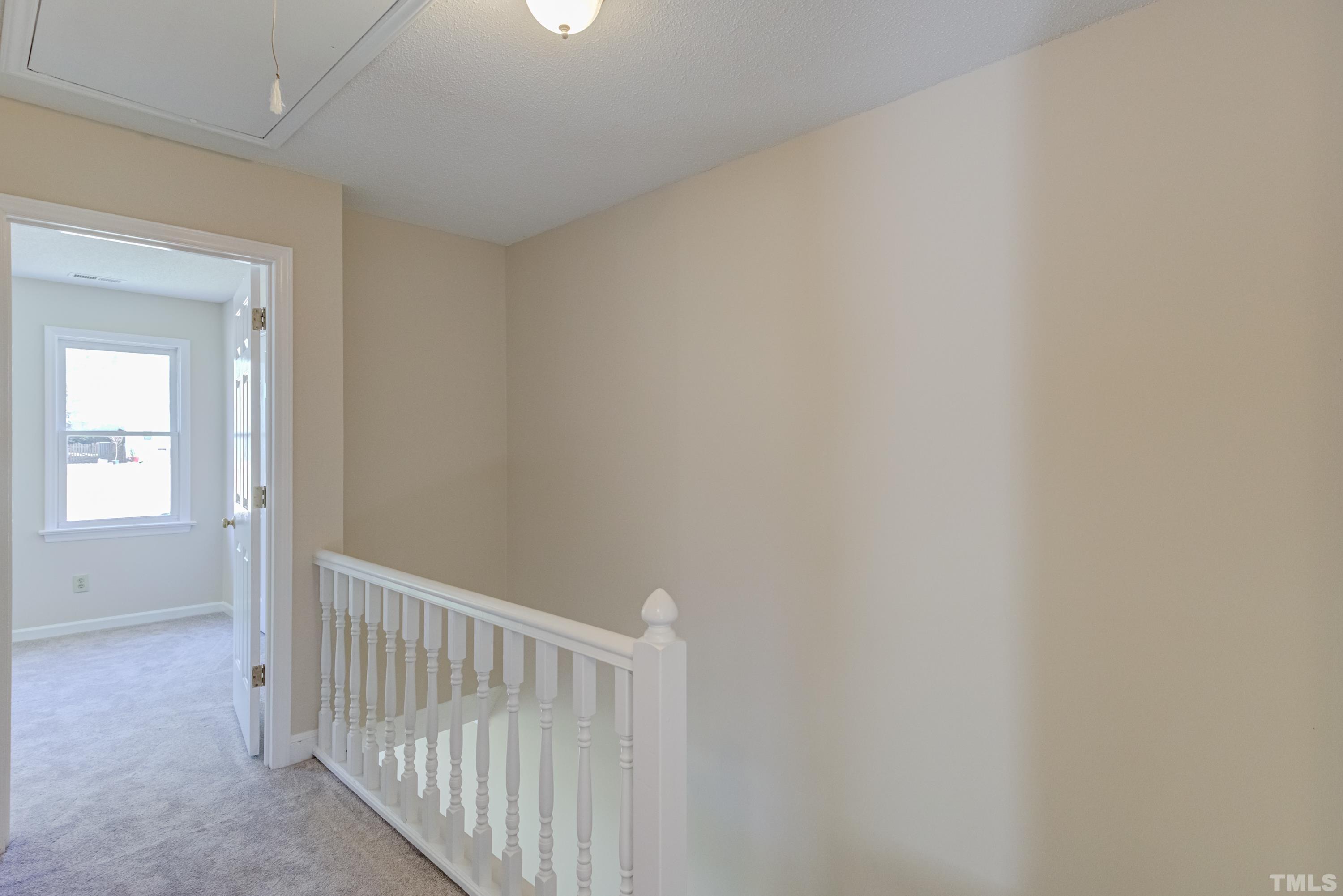 7307 Wilderness Road Raleigh, NC 27613 - Photo 12 of 14 a view of a hallway
